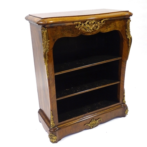 440 - A 19th century walnut open bookcase of small size, with shaped top, floral marquetry inlaid frieze a... 