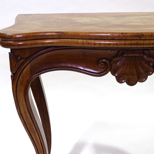 442 - A 19th century walnut fold over card with carved frieze and cabriole legs, width 83cm