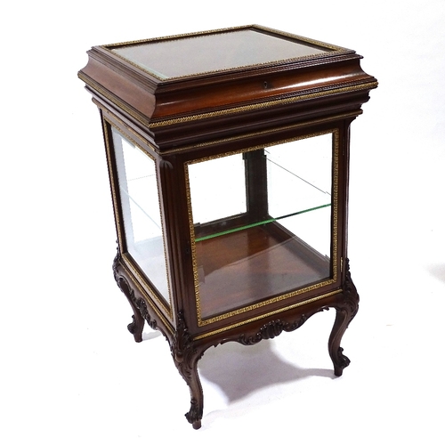 444 - A fine quality late 19th century mahogany vitrine cabinet with bevel-glass panels, rising top and cu... 