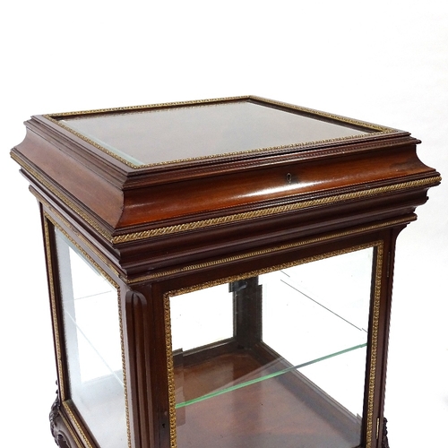 444 - A fine quality late 19th century mahogany vitrine cabinet with bevel-glass panels, rising top and cu... 