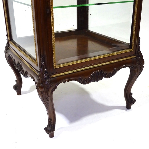 444 - A fine quality late 19th century mahogany vitrine cabinet with bevel-glass panels, rising top and cu... 