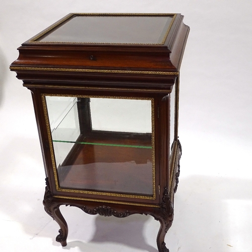 444 - A fine quality late 19th century mahogany vitrine cabinet with bevel-glass panels, rising top and cu... 