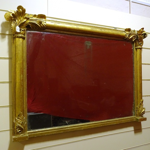 134 - A 19th century carved giltwood framed overmantle mirror with acanthus pediment, width excluding leaf... 