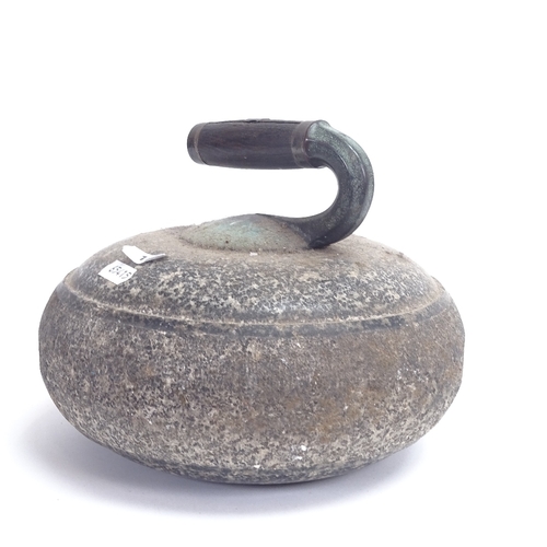 10 - An Antique granite curling stone with brass silver-mounted turned ebony handle, diameter 24cm