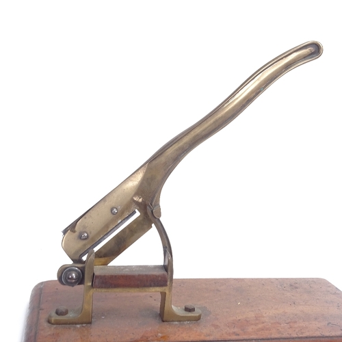 11 - A Victorian table-top brass paper guillotine, on rectangular mahogany base, base length 46cm