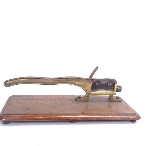 11 - A Victorian table-top brass paper guillotine, on rectangular mahogany base, base length 46cm