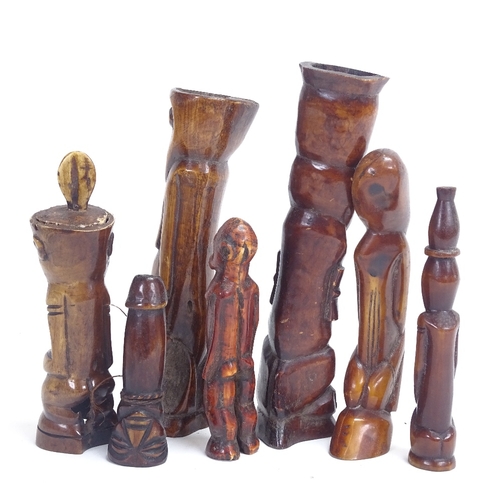 12 - A group of 19th century African Tribal carved and stained ivory and bone figures, probably Lega, inc... 