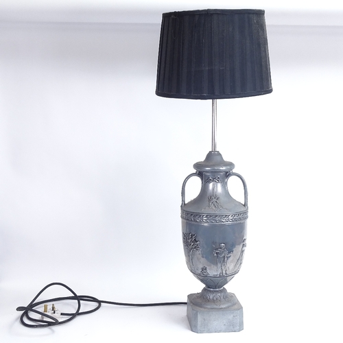 24 - A Victorian style aluminium pedestal urn table lamp, relief embossed Classical figure and Adam style... 