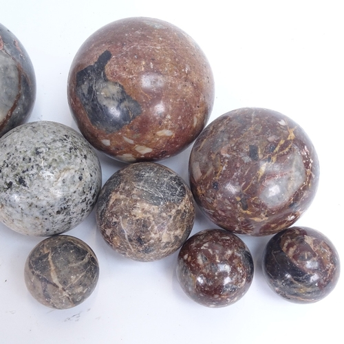 27 - Various carved and polished hardstone orbs, including jasper, largest diameter 13cm