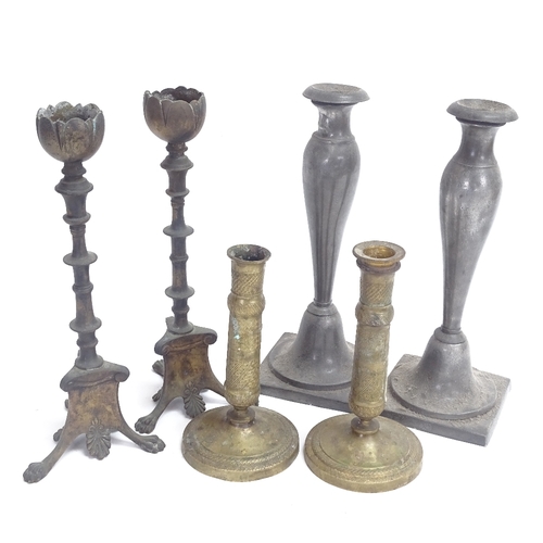 35 - 2 pairs of brass table candlesticks, and a pair of pewter Nouveau candlesticks, largest height 27cm ... 