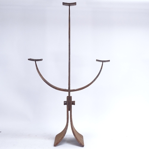 46 - A large cast-iron candle holder, height 84cm