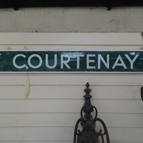 50 - A Vintage green and white enamel Sampford Courtenay enamel railway sign, mounted on wood backing, ov... 