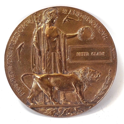 128 - A First War Period bronze death plaque awarded to Peter Clark