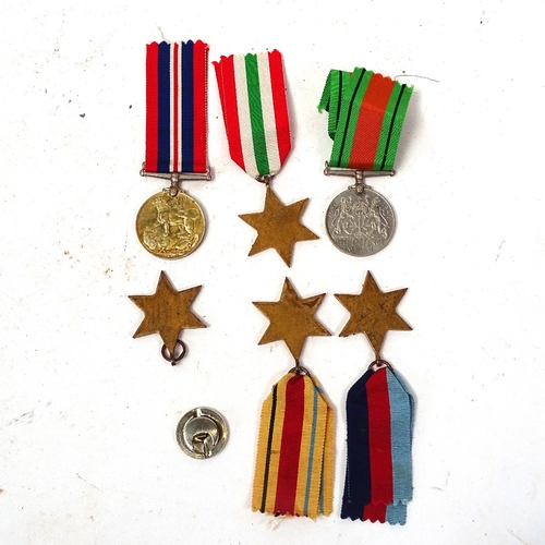 129 - Various unnamed Second War medals, comprising War and Defence medal, 2 1939 - 1945 Stars, Africa Sta... 