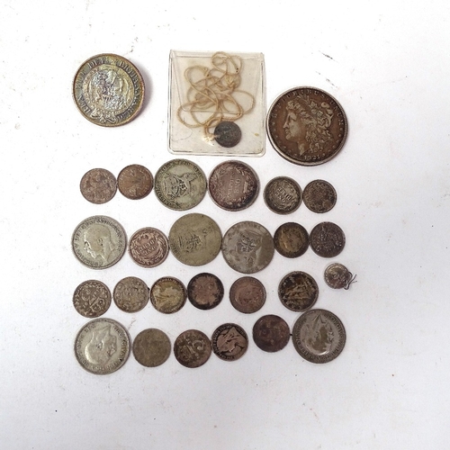 134 - A quantity of British and world coins, including silver American dollars, banknotes, crowns, etc