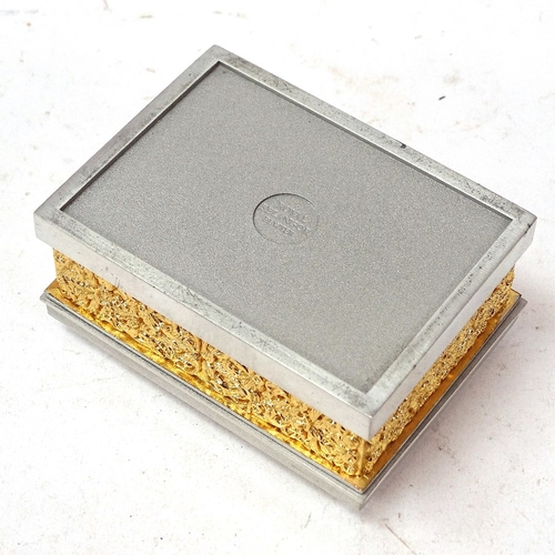 142 - A Royal Selangor pewter and gold plated box and cover, relief floral banded decoration, length 8.5cm