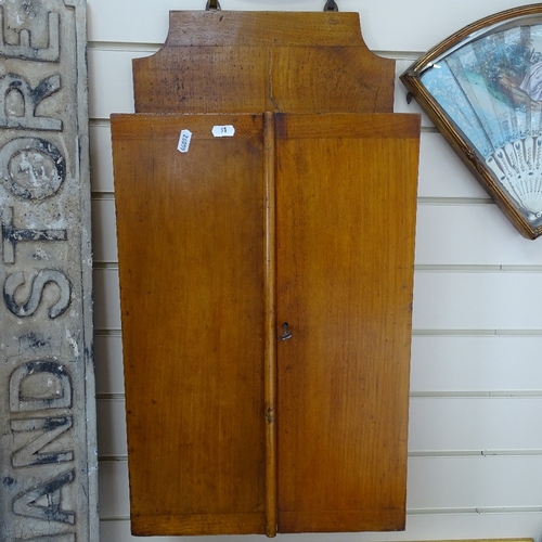 91 - A Victorian panelled oak carpenter's tool cabinet, with label for Sheffield Works, and some tools