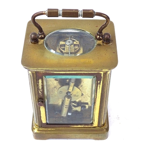 97 - A brass-cased carriage clock, case height 11cm, not currently working, with key