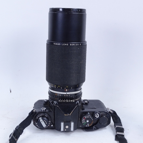 179 - A Vintage Nikon FESLR camera with accessories, including Zoom 70~210mm 1:4, etc