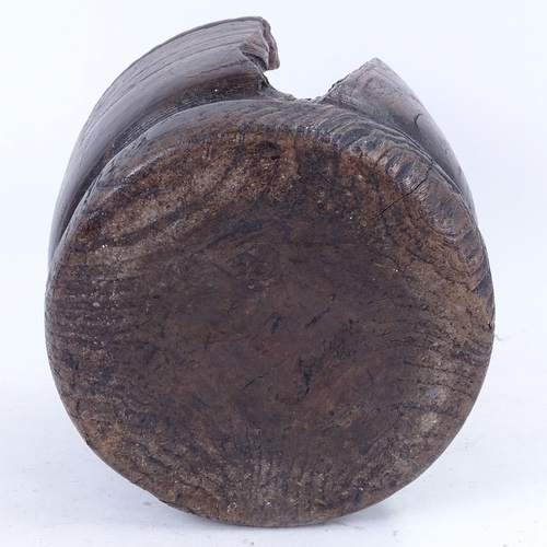 180 - An 18th century turned wood mortar, diameter 23cm, chunk missing and stapled