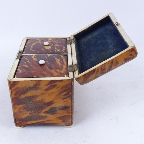 182 - A Regency blonde tortoiseshell tea caddy with velvet-lined lid, 2 inner lids and ivory bun feet, len... 