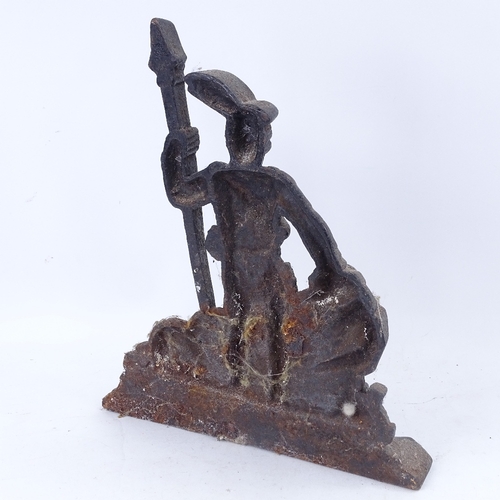 191 - A large black painted cast-iron figural doorstop, depicting guard leaning on rocks, overall height 3... 