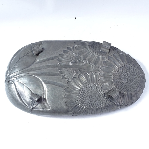 222 - An Italian Art Nouveau large pewter dish, by B Bellotti, relief embossed sunflower decoration with s... 