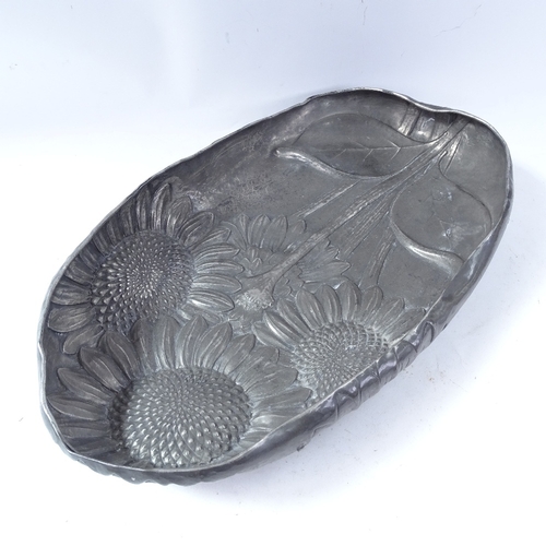 222 - An Italian Art Nouveau large pewter dish, by B Bellotti, relief embossed sunflower decoration with s... 