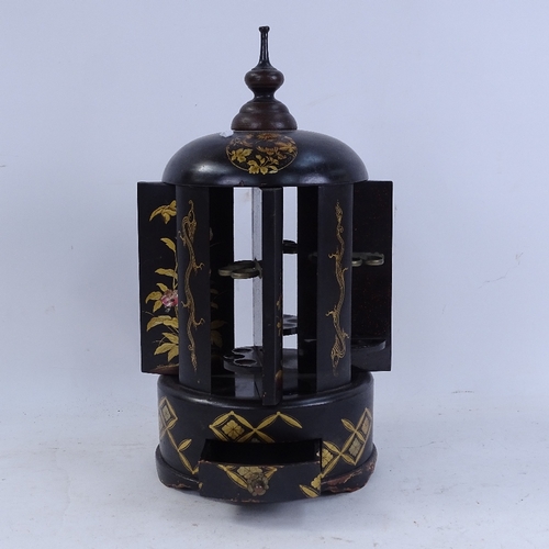 240 - An Oriental ebonised and gilded wood mechanical cigar stand/dispenser, with twisting knop, height 34... 