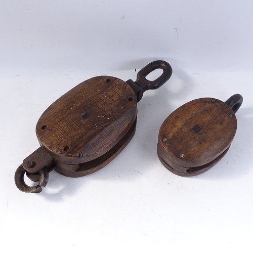 242 - 2 Vintage oak ship's pulley blocks, largest overall length 52cm (2)