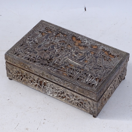 243 - An Oriental silver plated rectangular cigarette box, relief and pierced lake and floral lid, unmarke... 