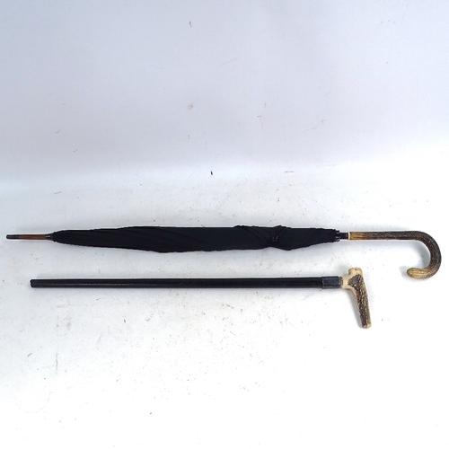 244 - A Vintage snakeskin-handled parasol, and a stag horn-handled ebony walking cane with silver collar (... 