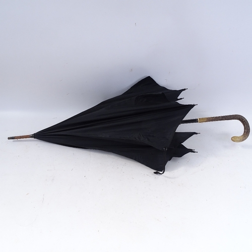 244 - A Vintage snakeskin-handled parasol, and a stag horn-handled ebony walking cane with silver collar (... 