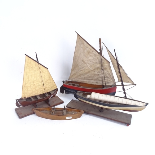 76 - Various Vintage wooden hulled pond yachts, largest length 29cm (4)