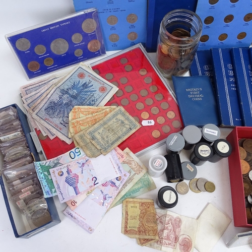 86 - A collection of various world coins and banknotes