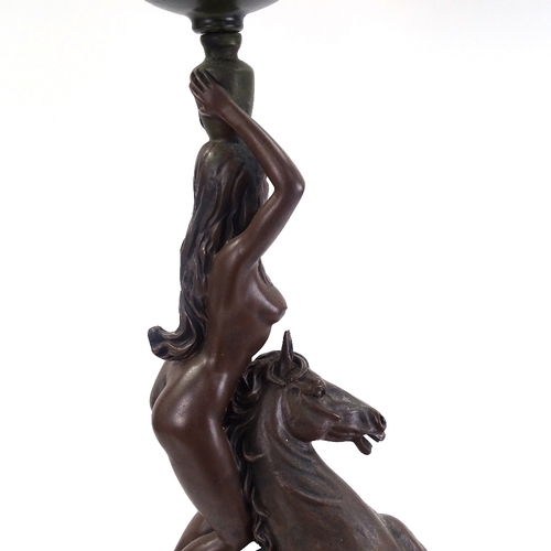 249 - A large resin figural table lamp, depicting nude figure standing on horseback, with crackle shade, o... 