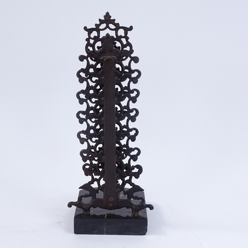 252 - A wrought-iron 7-section tiered letter rack on veined black marble plinth, marked Hanau, overall hei... 