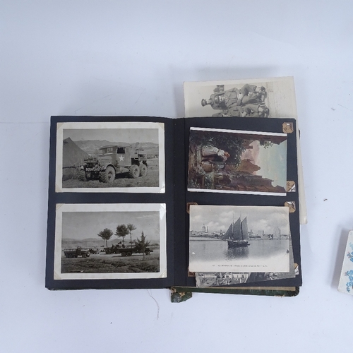 276 - A collection of various military ephemera, including original photograph album, service book, ordnan... 