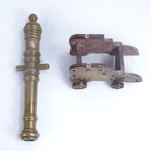 281 - A bronze and brass-mounted table cannon, and a brass oil burner (2)