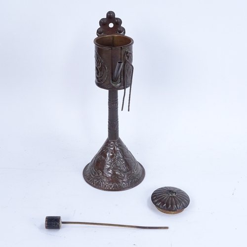 281 - A bronze and brass-mounted table cannon, and a brass oil burner (2)