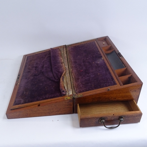 311 - An early 20th century mahogany folding writing slope, with fitted interior and frieze drawer, length... 