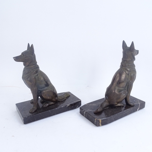 313 - A pair of Art Deco pewter Alsatian dog bookends, on veined black marble plinths, overall height 18cm