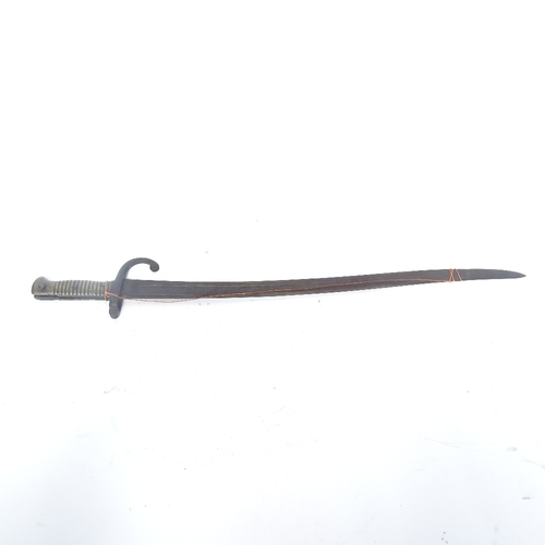 353 - A French First War Period sword bayonet, and a Tribal spear head, bayonet blade length 57cm (2)