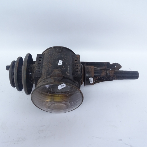 354 - A black painted cast-iron carriage oil lamp with wall mounting bracket, lamp height 51cm