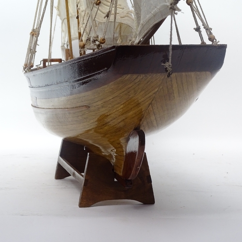 363 - A scratch-built wooden hull model boat, with sails and rigging, overall height 80cm