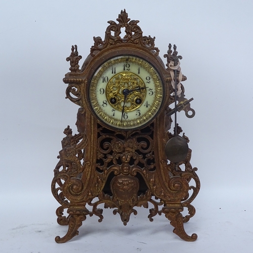 365 - A painted cast-iron 8-day mantel clock, enamel dial with pendulum and key, height 36cm