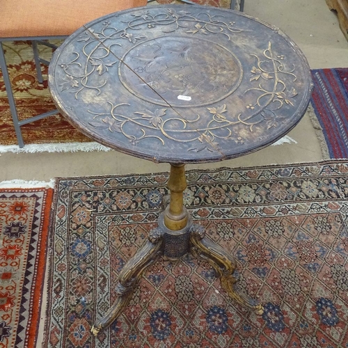 1538 - A Victorian walnut occasional table, with relief carved top, on tripod base, W53cm, H75cm