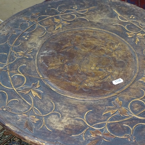 1538 - A Victorian walnut occasional table, with relief carved top, on tripod base, W53cm, H75cm