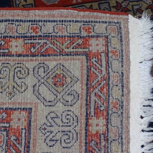 1539 - A blue and red ground Caucasian rug, 240cm x 150cm