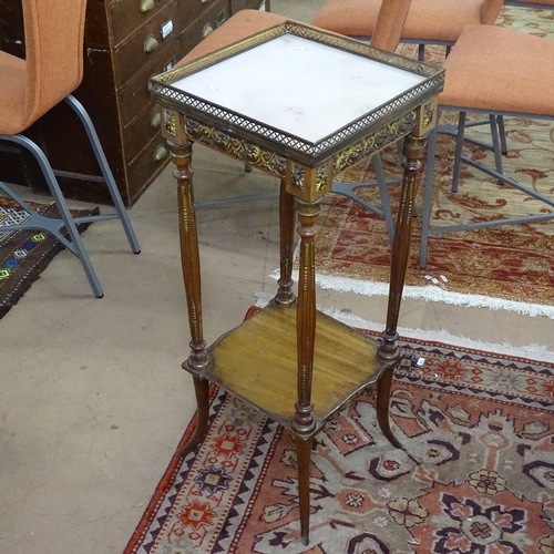 1540 - A French walnut jardiniere stand, with pierced brass gallery, marble top, on fluted legs and ormolu ... 